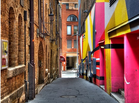 One side of this alley is in a historic district, the other is not.  Can you guess which is which?